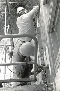Scaffold and site sheds around a house under construction